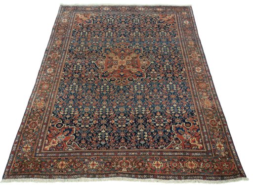 Surface texture of 1930s Farahan rug with natural Wool and intricate pattern
