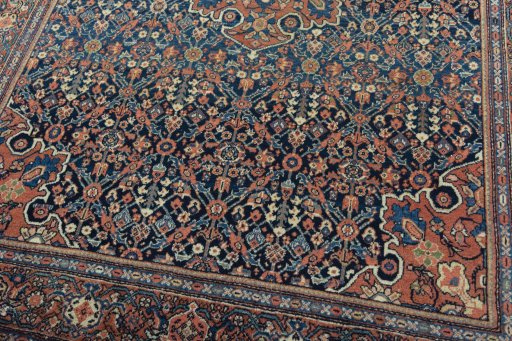 Close-up detail of 1930s Farahan rug from Iran / Persia showing Wool weave