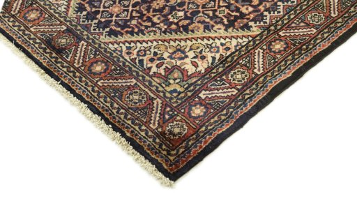Surface texture of 2000s Farahan rug with natural Wool and intricate pattern