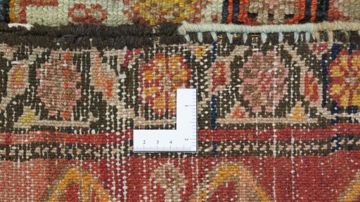 Close-up detail of 1920s Farahan rug from Iran / Persia showing Wool weave