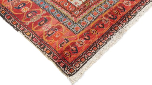 Surface texture of 1920s Farahan rug with natural Wool and intricate pattern