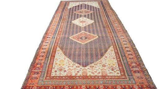 Close-up detail of 1920s Farahan rug from Iran / Persia showing Wool weave