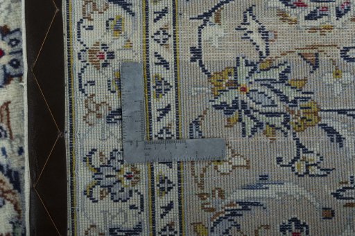 Backside of handmade 2000s Kashan rug showing knot structure and weave density