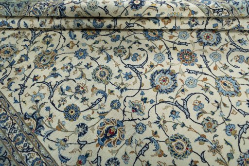 Close-up detail of 2000s Kashan rug from Iran / Persia showing Wool weave