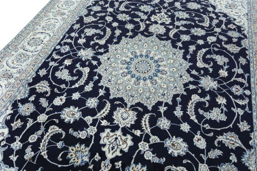 Backside of handmade New Nain rug showing knot structure and weave density