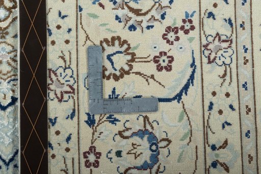 Backside of handmade 2000s Nain rug showing knot structure and weave density