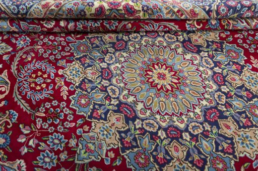 Close-up detail of 1970s Kerman rug from Iran / Persia showing Wool weave