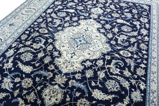 Backside of handmade 2000s Nain rug showing knot structure and weave density