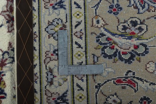 Backside of handmade 2000s Kashan rug showing knot structure and weave density