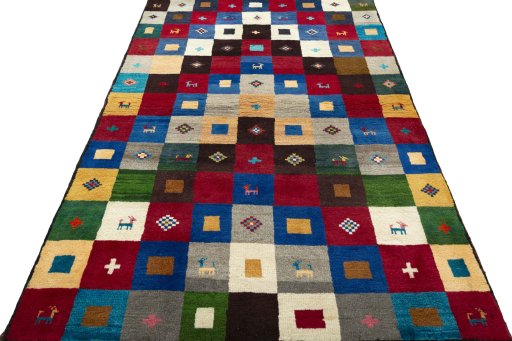 Surface texture of 2000s Persian Gabbeh rug with natural Wool and intricate pattern