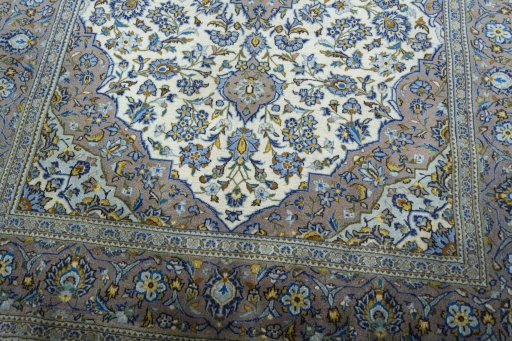 Close-up detail of 2000s Kashan rug from Iran / Persia showing Wool weave