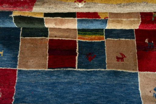 Full view of 2000s Persian Gabbeh rug from Pakistan, 170 × 106 cm in Multi Color tones