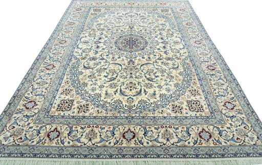 Surface texture of 2000s Nain rug with natural Wool and intricate pattern