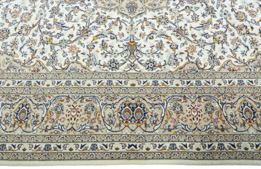 Corner detail of 2000s Kashan rug showing border pattern and Wool pile