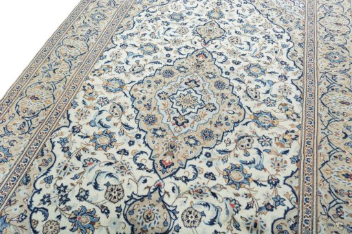 Backside of handmade 2000s Kashan rug showing knot structure and weave density