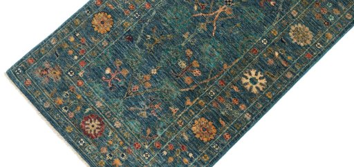 Backside of handmade New Farahan rug showing knot structure and weave density