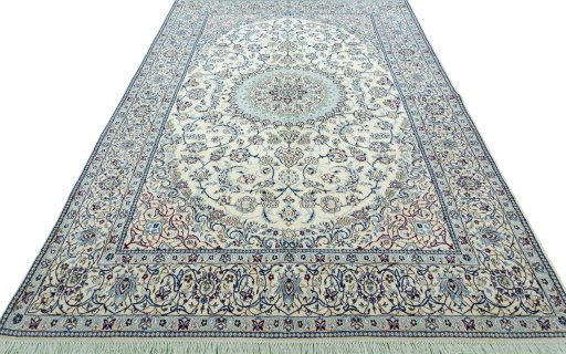 Surface texture of 2000s Nain rug with natural Wool and intricate pattern