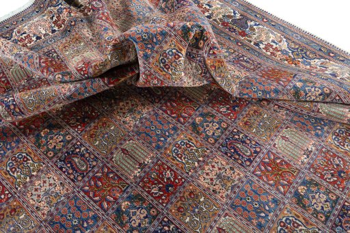 Corner detail of 2000s Moud rug showing border pattern and Wool pile