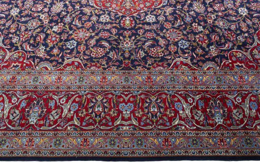 Corner detail of New Kashan rug showing border pattern and Cork pile
