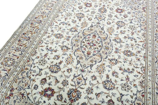 Backside of handmade 2000s Kashan rug showing knot structure and weave density