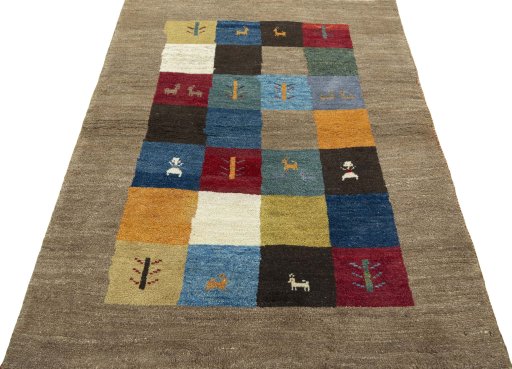 Surface texture of 2000s Persian Gabbeh rug with natural Wool and intricate pattern