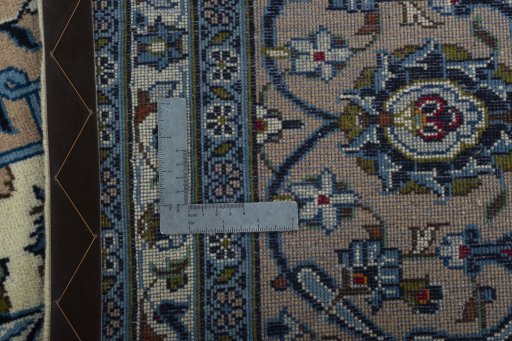 Backside of handmade 2000s Kashan rug showing knot structure and weave density