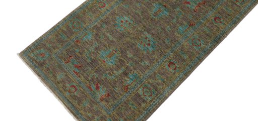 Backside of handmade New Farahan rug showing knot structure and weave density