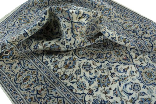 Surface texture of 2000s Kashan rug with natural Wool and intricate pattern