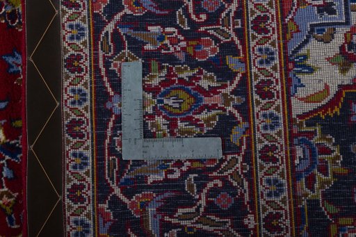 Surface texture of 2000s Kashan rug with natural Wool and intricate pattern