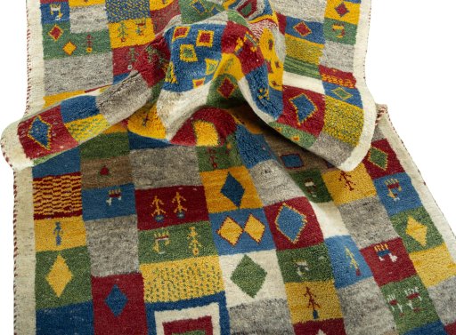 Corner detail of 2000s Persian Gabbeh rug showing border pattern and Wool pile