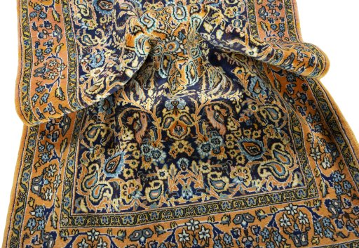 Close-up detail of 1970s Ghom rug from Iran / Persia showing Wool weave