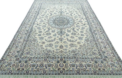 Surface texture of 2000s Nain rug with natural Wool and intricate pattern
