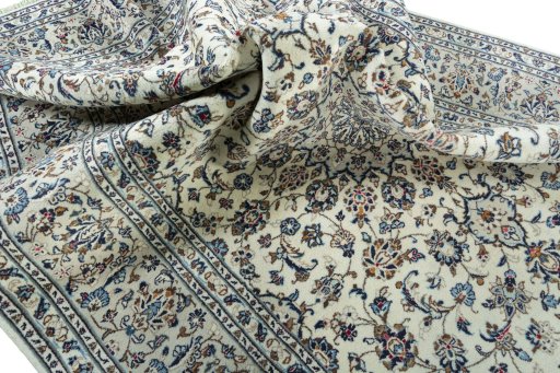 Surface texture of 2000s Kashan rug with natural Wool and intricate pattern