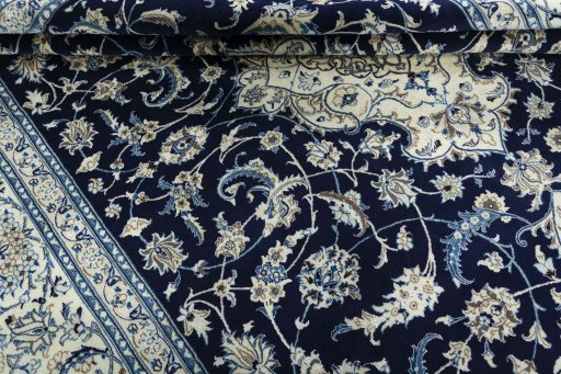 Close-up detail of 2000s Nain rug from Iran / Persia showing Wool weave