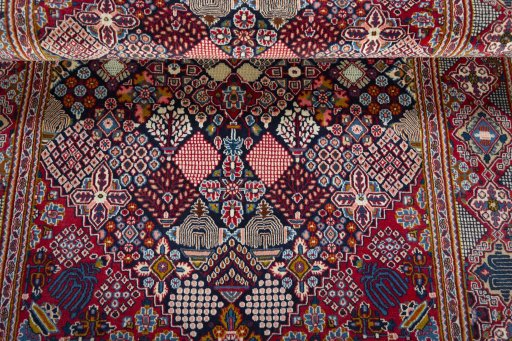 Close-up detail of 2000s Kashan rug from Iran / Persia showing Wool weave