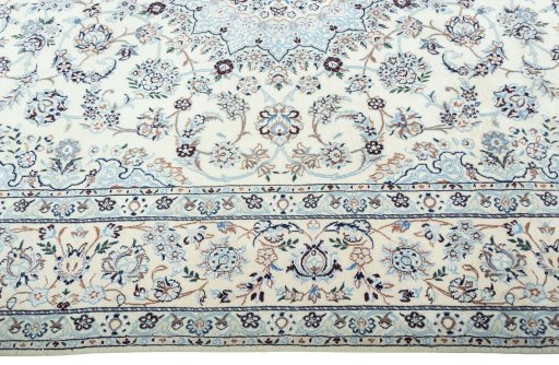 Corner detail of New Nain rug showing border pattern and Wool pile