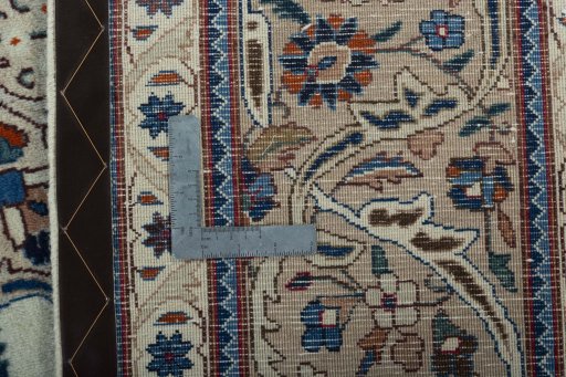 Backside of handmade 2000s Kashmar rug showing knot structure and weave density