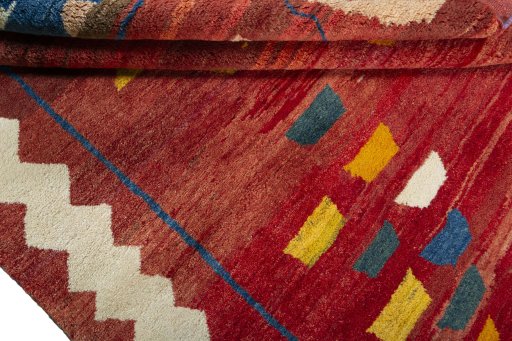 Full view of 2000s Persian Gabbeh rug from Pakistan, 230 × 184 cm in Red tones