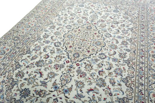 Backside of handmade 2000s Kashan rug showing knot structure and weave density