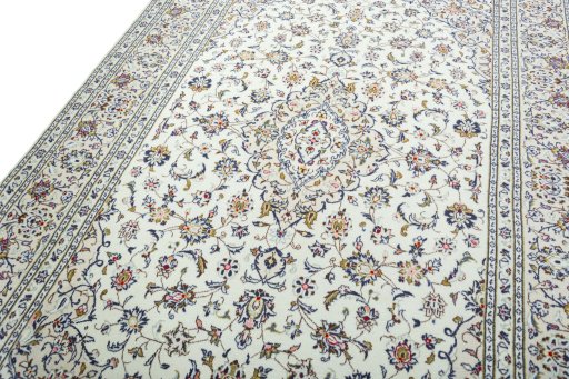 Backside of handmade 2000s Kashan rug showing knot structure and weave density