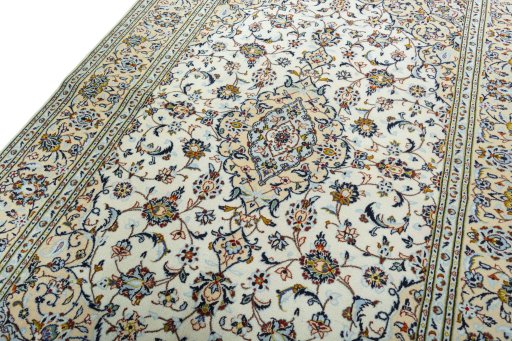Backside of handmade 2000s Kashan rug showing knot structure and weave density