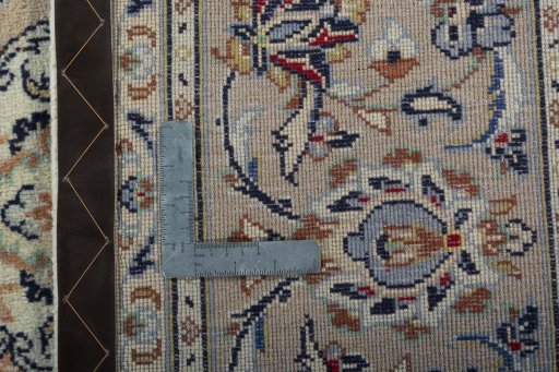 Backside of handmade New Kashan rug showing knot structure and weave density