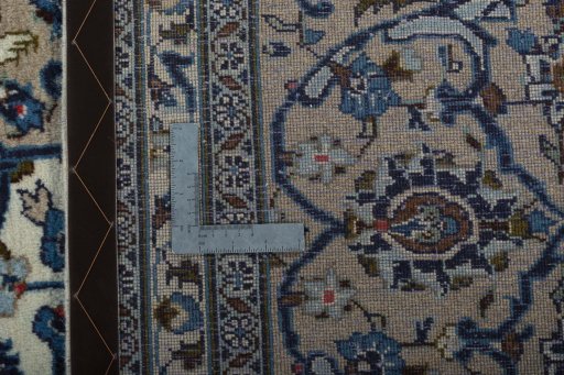 Backside of handmade 2000s Kashan rug showing knot structure and weave density
