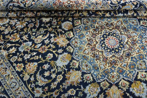 Close-up detail of 2000s Kashan rug from Iran / Persia showing Wool weave