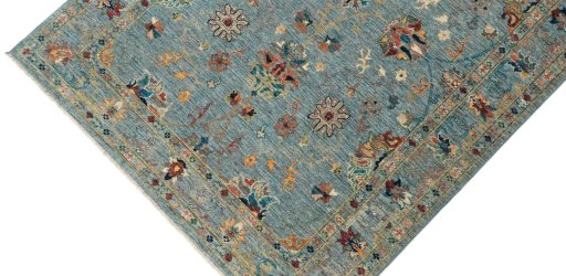 Backside of handmade New Farahan rug showing knot structure and weave density