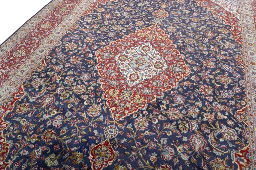 Backside of handmade New Kashan rug showing knot structure and weave density