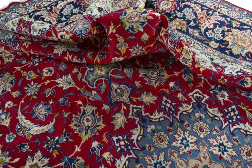 Surface texture of 2000s Najafabad rug with natural Wool and intricate pattern