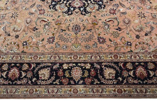 Corner detail of 2000s Tabriz 50/60/70 Raj rug showing border pattern and Cork pile