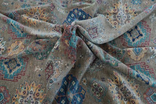 Full view of New Kazak rug from Pakistan, 379 × 276 cm in Green tones