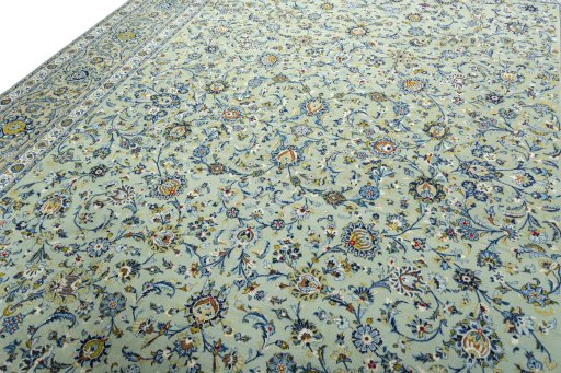 Backside of handmade 2000s Kashan rug showing knot structure and weave density